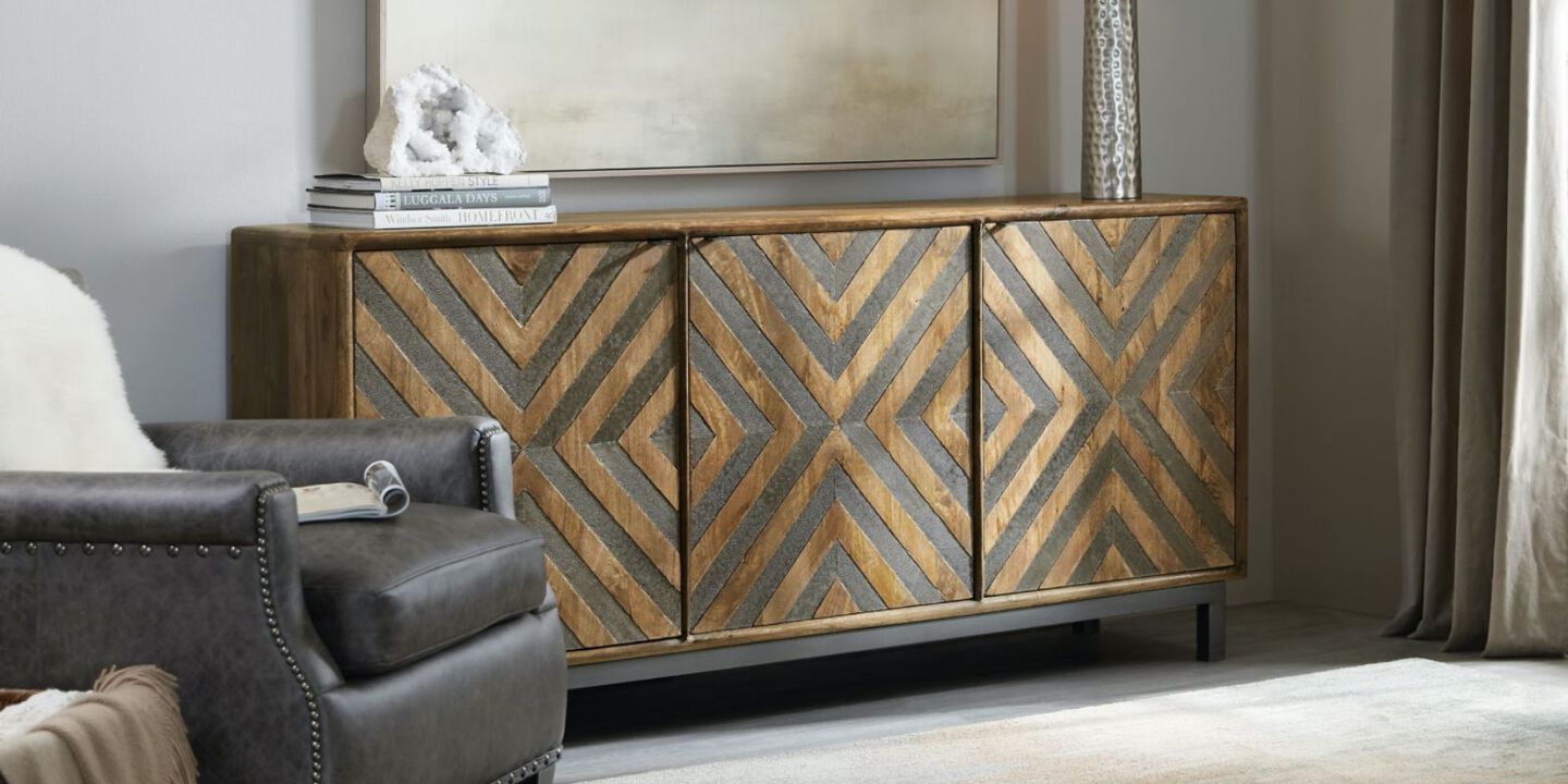 grey and brown wooden credenza with geometric pattern on the doors