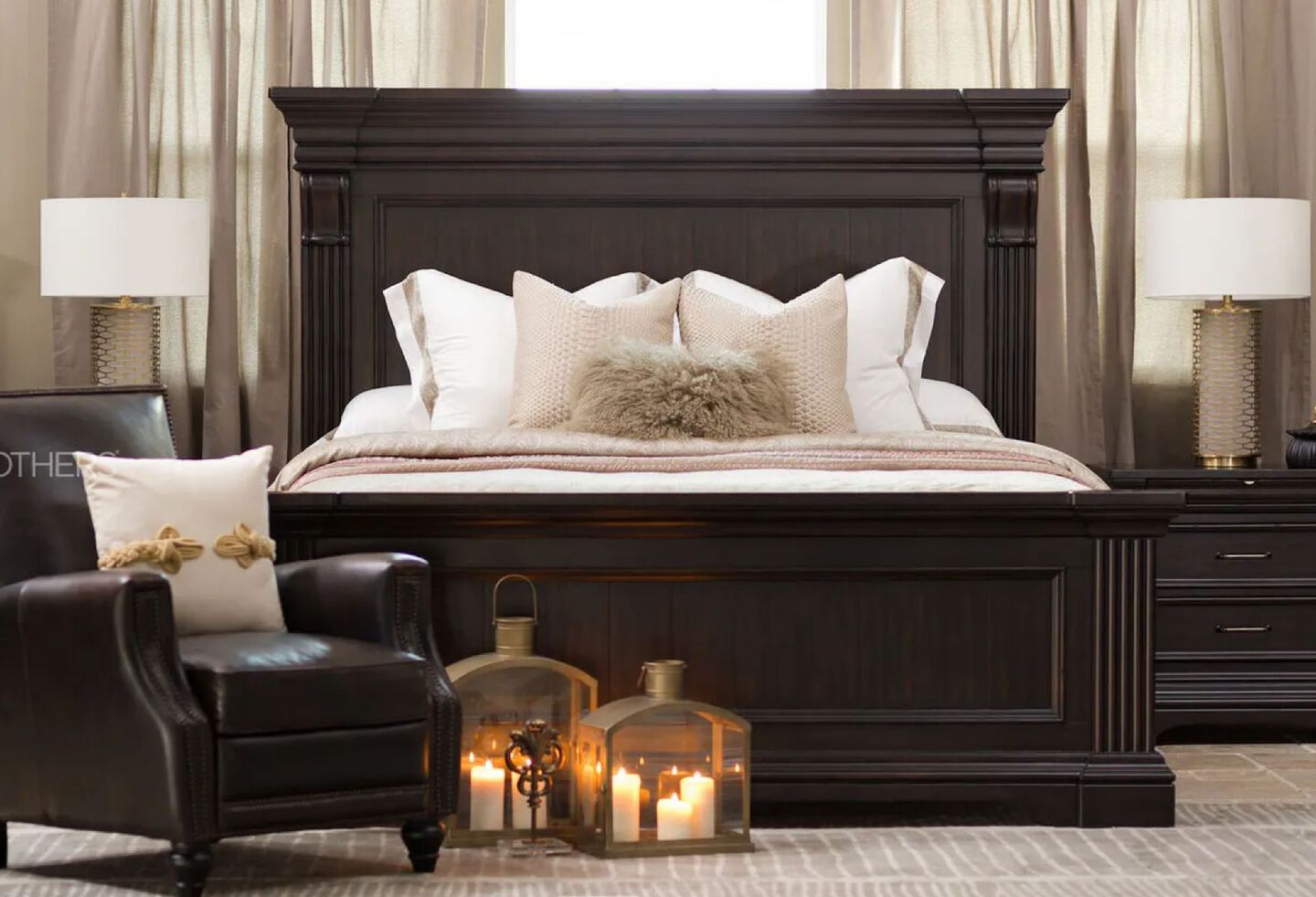 Dark brown panel bed in a bedroom with matching nightstands and dark brown leather chair