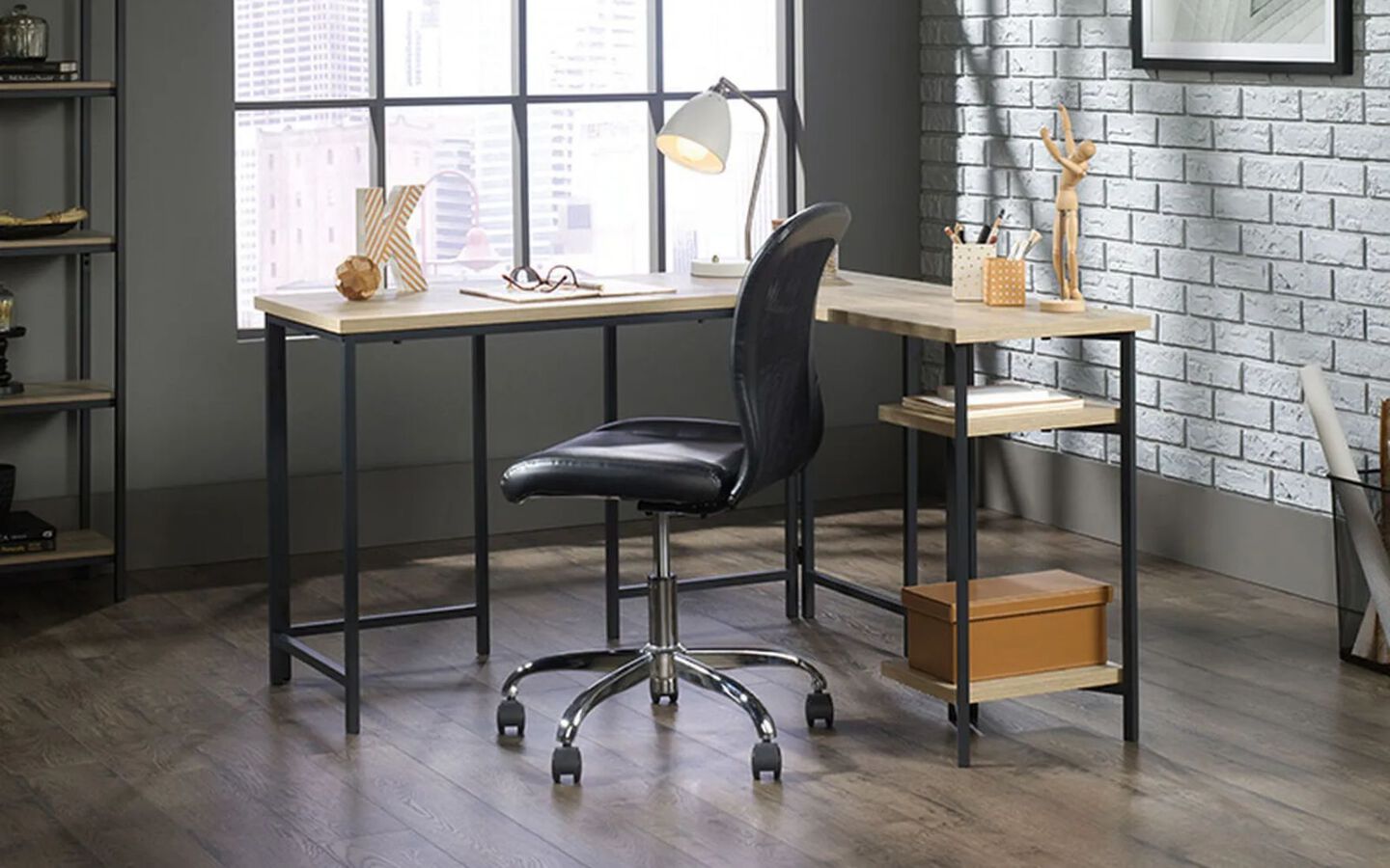 Office with grey and black metal desk and black swivel chair