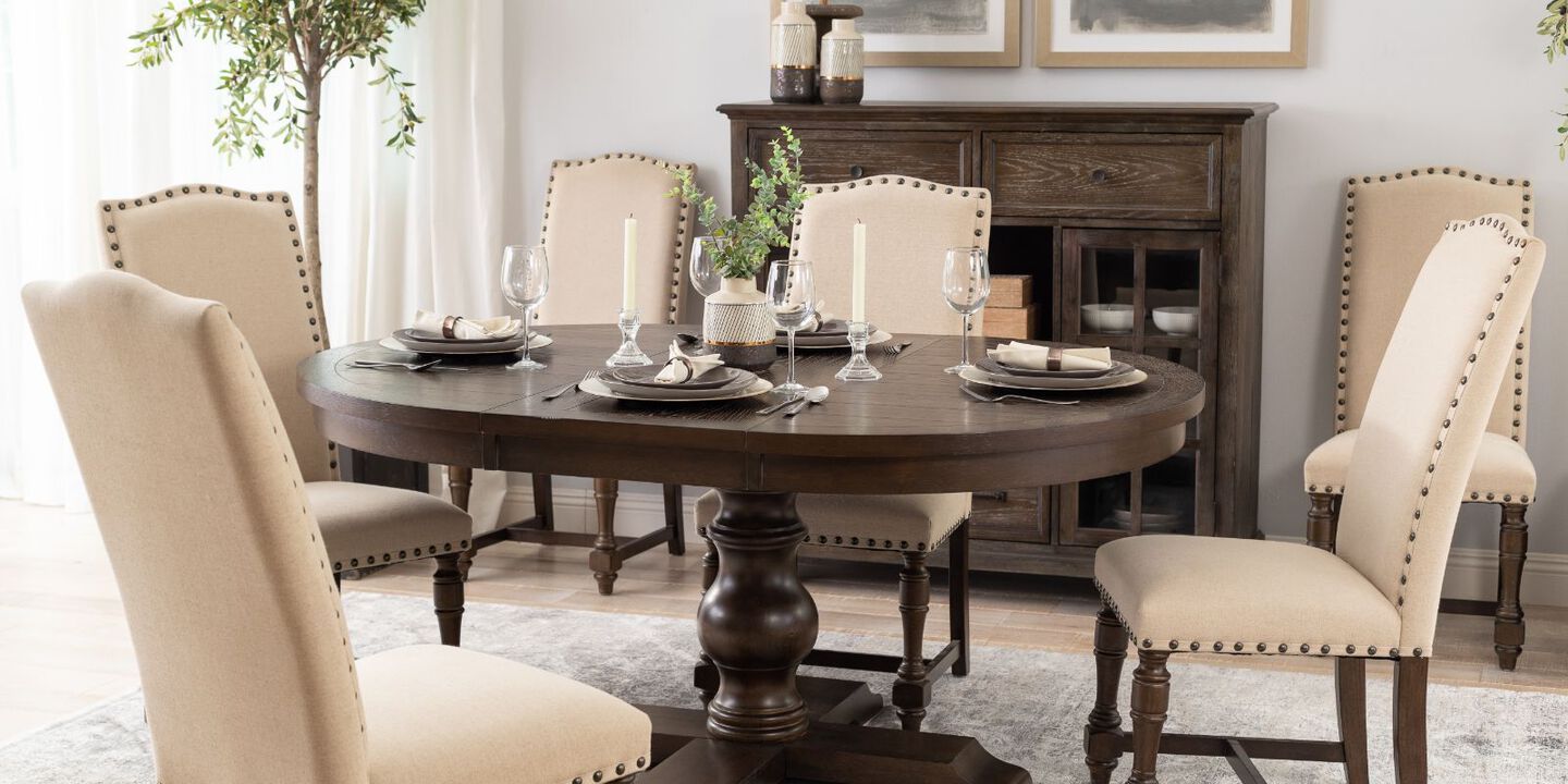 dark brown dining table with light beige upholstered chairs