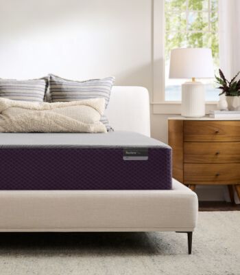 Purple mattress on a platform bed in beige