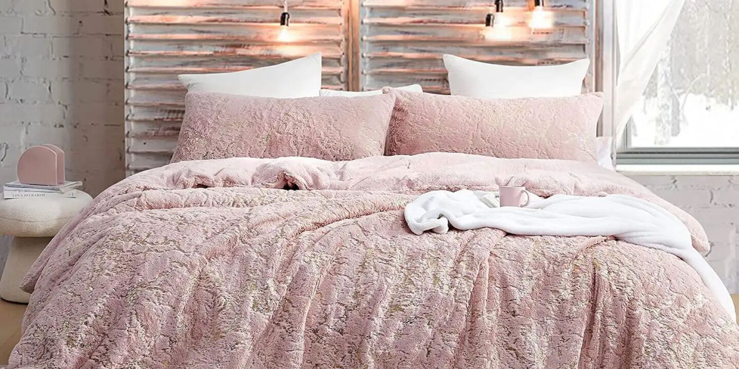 Bed with pink comforter and matching pink pillows