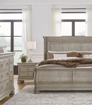 Ashley Furniture classic bedroom set with light wood finish