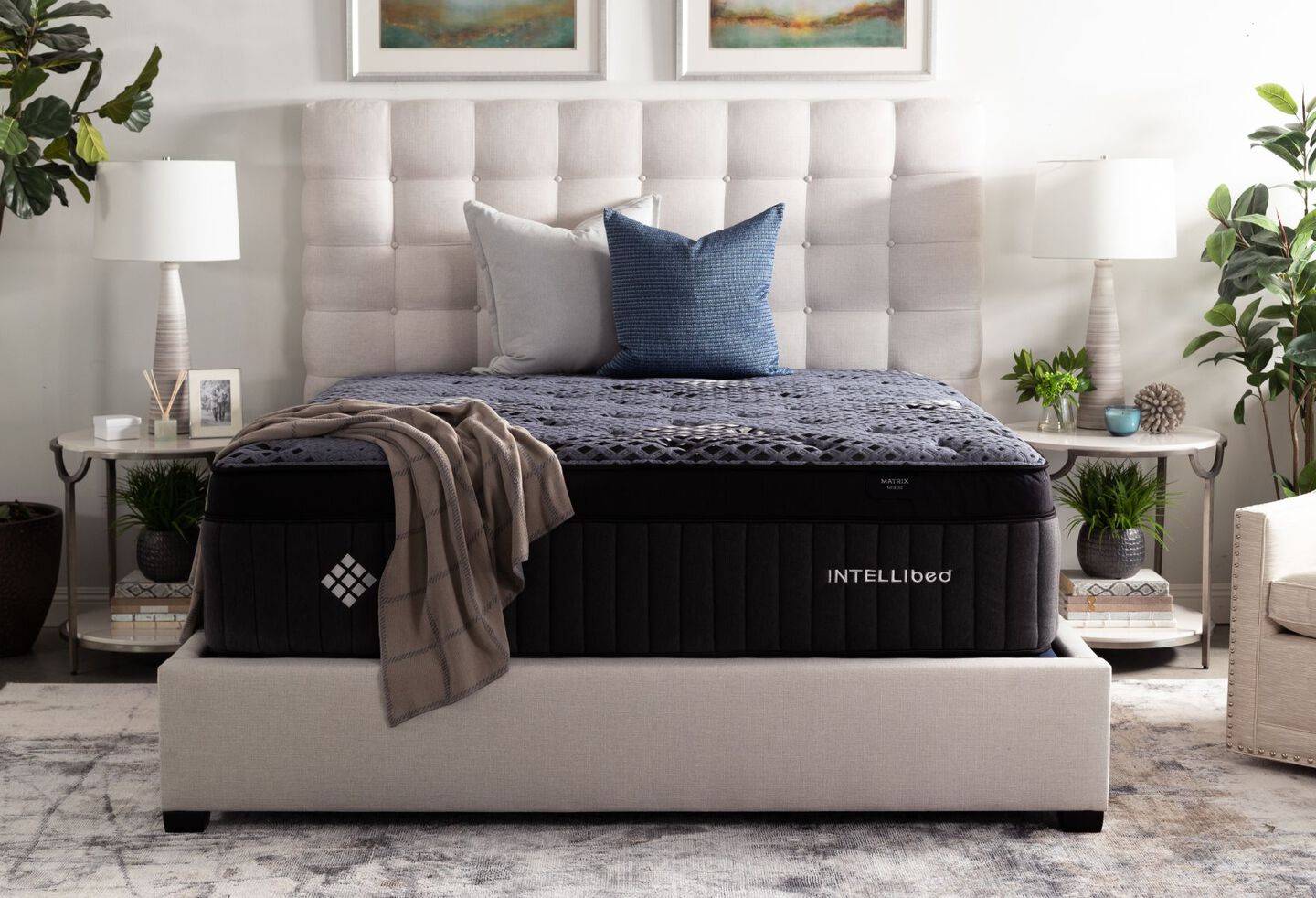 Navy blue americana mattress on top of a grey bedframe
