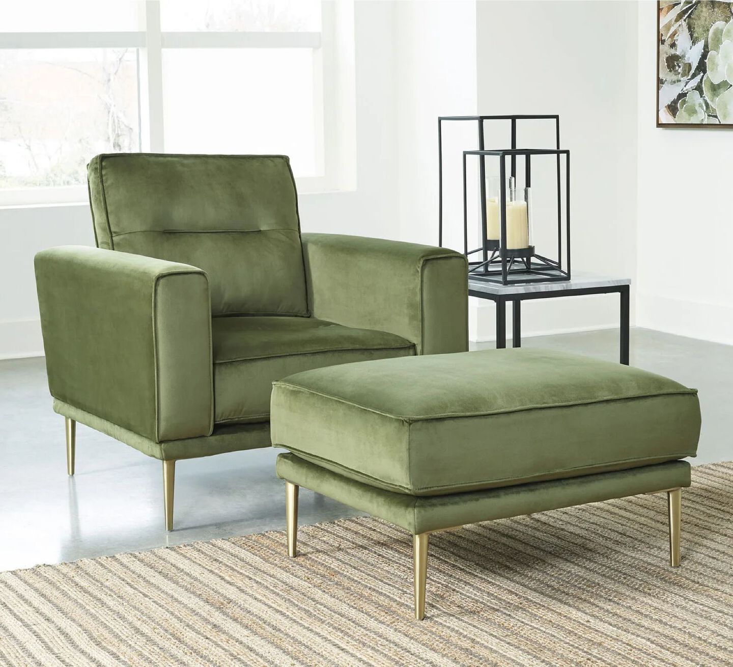 Living room with green plush chair with gold metallic legs and a matching ottoman