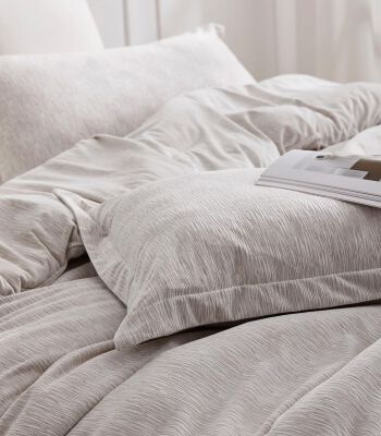 beige color soft texture bedding collection from coma inducer
