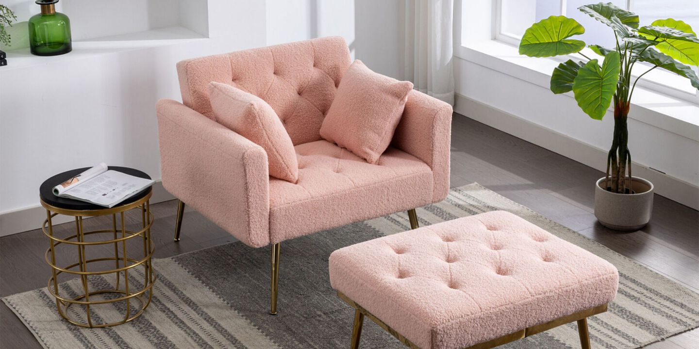 Pink plush accent chair with foot rest on top of a neutral colored rug
