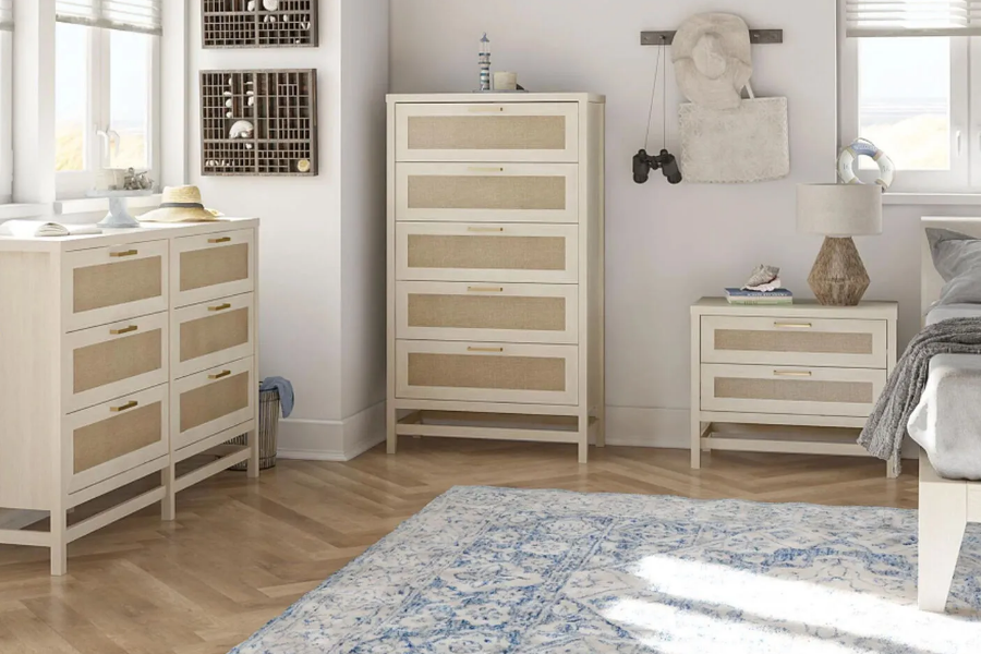 Bedroom with two ivory and beige dressers and a matching nightstand