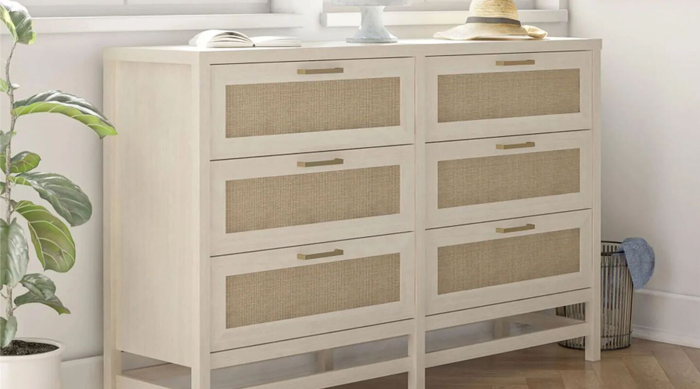 Ivory and beige dresser with hat and other accessorie on top