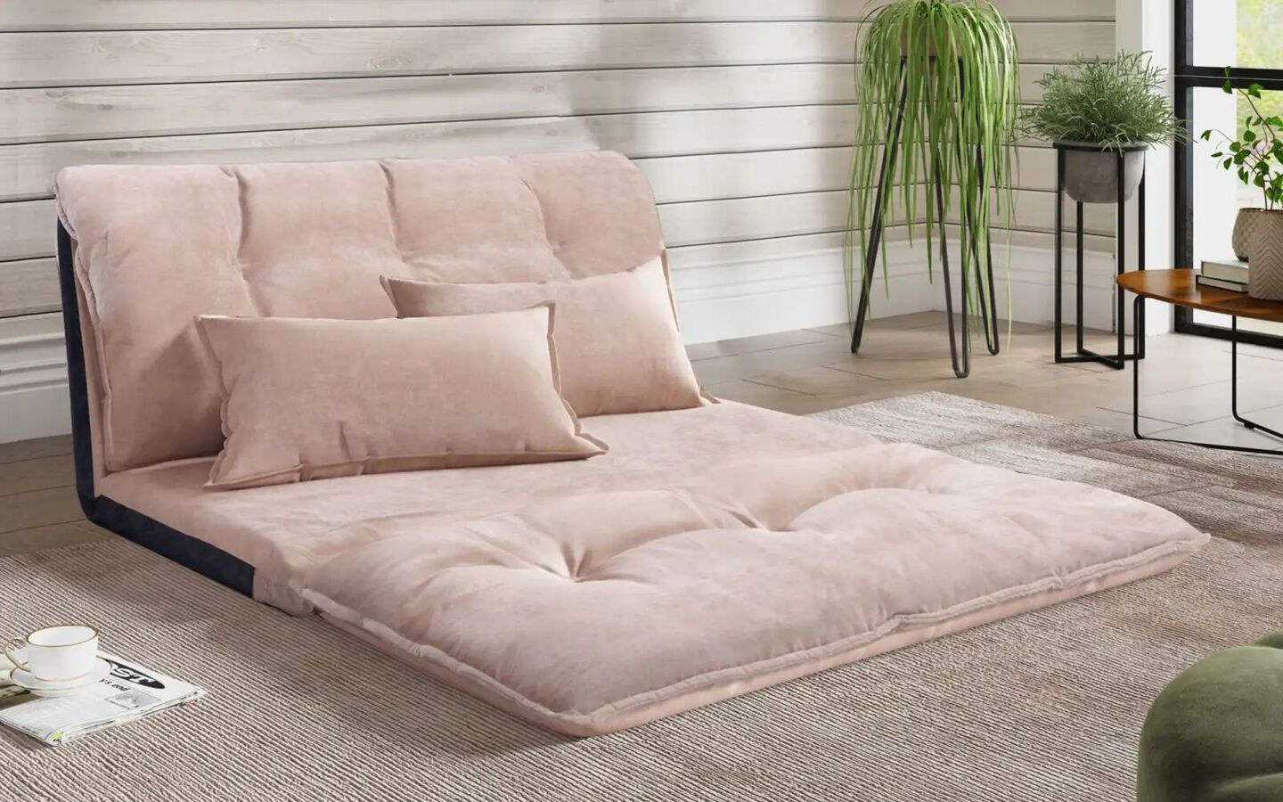 Light pink futon with matching light pink pillows