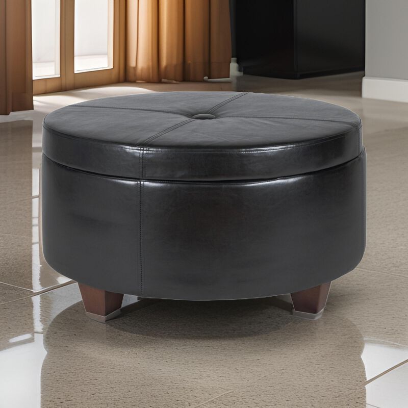Leatherette Single Button Tufted Round Ottoman with Wooden Feet, Large, Black and Brown - Benzara