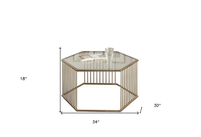 Homezia 34" Champagne And Clear Glass And Metal Hexagon Coffee Table